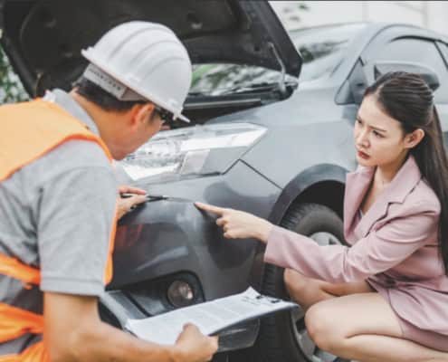 male insurance officer came to help inspect a customer's car that had an accident. Concept for vehicle crash, insurance claim.